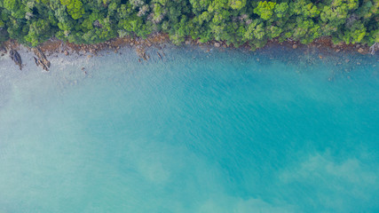 Aerial view photo, Tropical beach with ocean and rock on the island