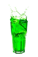 Green soda splashing out of glass isolated on white background.