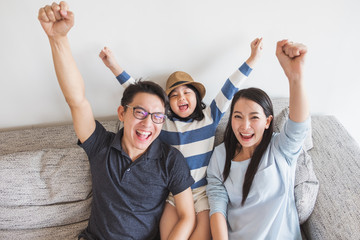 Happy Asian family rising hand smile laughing and cheerful