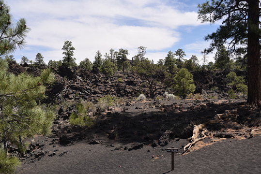 Flagstaff, AZ., U.S.A. June 5, 2018. Sunset Crater Volcano National Monument est. in 1930. Sunset Crater Volcano is a prime example of an 1,120-foot cinder volcano with substantial lava flows. 