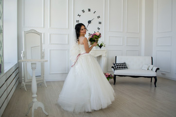 the bride in the white room with the clock