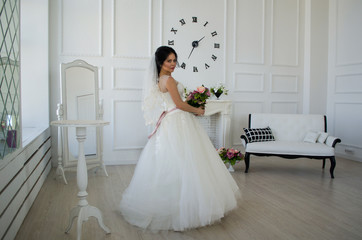 the bride in the white room with the clock