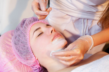 Woman in spa salon lying down and enjoy relaxing in the day spa. Different treatments at the spa