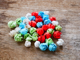 concept recycle paper,color crumpled paper on a table