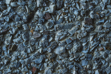 Grunge texture of crushed stone, cracked concrete and old asphalt