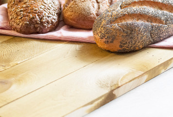 Fragrant Golden and crunchy bread on the kitchen table