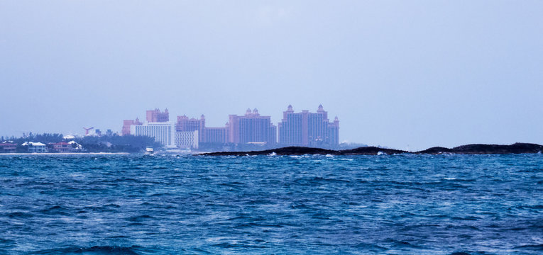Distant hotels on Paradise Island from a boat in the Ocean. Cloudy/Foggy day near Nassau in The Bahamas.