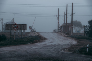 railway crossing in the fog