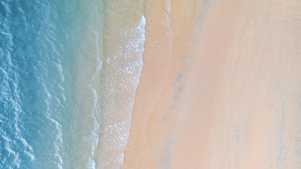 Fototapeta na wymiar Aerial view of Beach with shade emerald blue water and wave foam on tropical sea