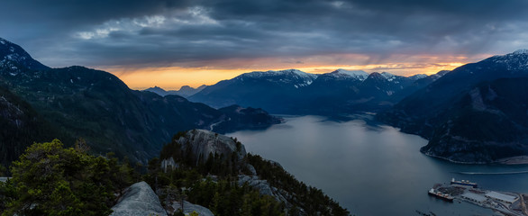 Scenic Panoramic Landscape view of the Beautiful Canadian Nature from the top of the Mountain during  a colorful sunset. Taken in Squamish, North of Vancouver, BC, Canada.