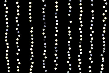 Bokeh white lights on black background. Abstract defocused many round light