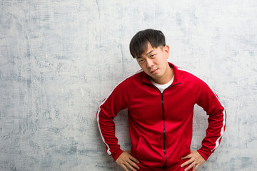 Young sport fitness chinese scolding someone very angry