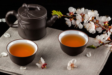 Chinese brown teapot and cups for tea