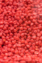 Raw Corn Seeds or Corn kernels are the fruits of corn. Maize is a grain, and the kernels are used in cooking as a vegetable or a source of starch. vertical photo