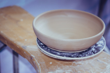 Ceramic clay products stand on the shelf close-up.