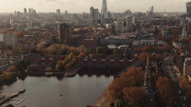 Aerial tilt up view of the skyline of central London from the East