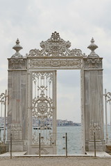 White openwork fence of the Dolmabahche Palace near the Bosphorus in Istanbul, Turkey