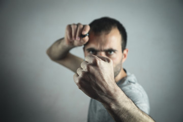 Caucasian angry man showing his fist.