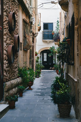 Fototapeta na wymiar Beautiful view of narrow medieval street in Mdina, ancient capital of Malta, fortified medieval town. Popular touristic destination and attraction