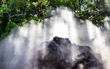 Detail view on steam of famous geothermal hot springs, called Tatsumaki Jigoku, engl. spout hell, in Beppu, Oita Prefecture, Japan, Asia.