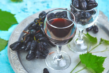Red wine concept with bottle, glass and grapes