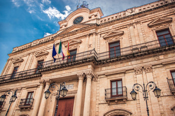 Fototapeta na wymiar Vizzini, Sicily, Italy: HDR city hall building of Vizzini and the beauty of its characteristic baroque architecture with blue sky in background