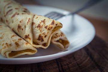 Fresh homemade spring rolls with chicken on white plate