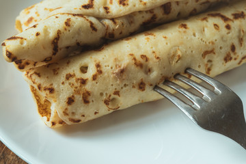 Fresh homemade spring rolls with chicken on white plate