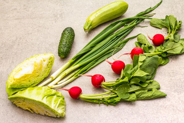 Assortment fresh organic vegetables. Food cooking stone background. Healthy vegetarian (vegan) eating concept, close up.