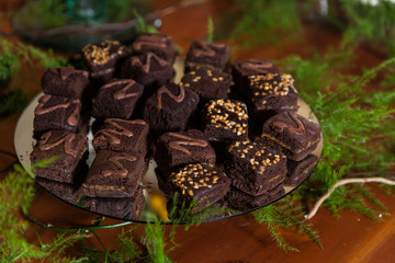Tasty chocolate brownies, portions with arequipe and peanuts