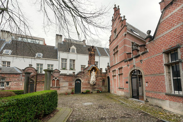 Brick walls of historical houses in Beguinage, 13th century complex for beguines women