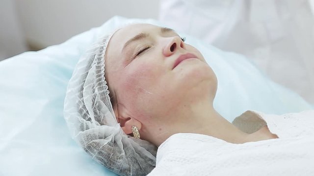 Cosmetician in gloves making face lifting injection to area around eyes. female client gets facial beauty procedure in healthcare clinic. liquid thread injection. Botox. collagen
