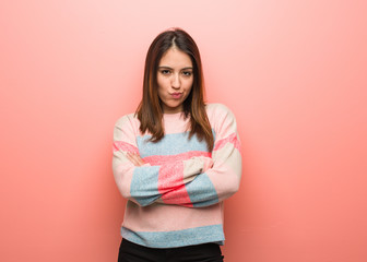 Young cute woman crossing arms relaxed