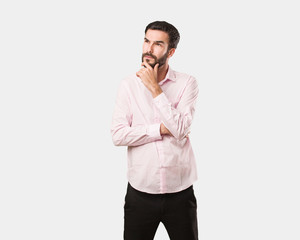 Young handsome man thinking about an idea