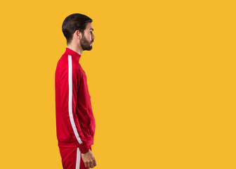 Young fitness man on the side looking to front