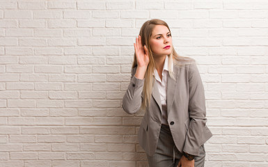 Young russian business woman embarrassed and laughing at the same time