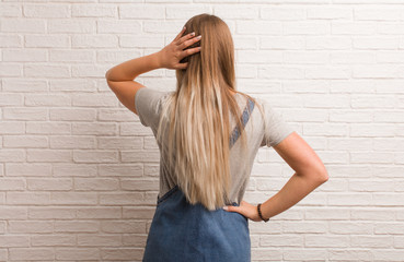 Young russian hipster woman from behind thinking about something