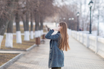 girl in a coat on the Volga river embankment in Cheboksary