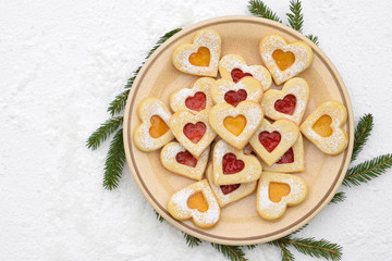 Homemade linzer cookies filled with strawberry and apricot jam