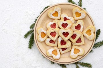Homemade linzer cookies filled with strawberry and apricot jam