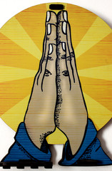 Decorative object representing a greeting with the imposition of hands, namaste, amen or gratitude, composing the wall decoration of a house in the city of São Paulo, Brazil.