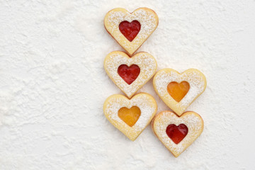 Fototapeta premium Homemade linzer cookies filled with strawberry and apricot jam