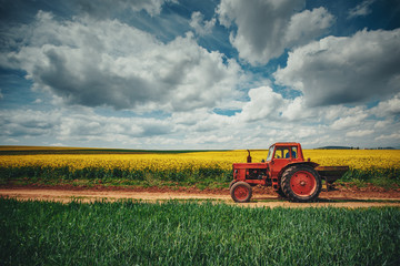Red tractor in a field