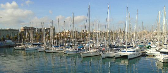 Barcelona harbour reflections shine on a winters day