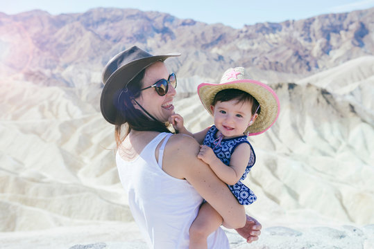 USA, California, Death Valley National Park, Twenty Mule Team Canyon, happy mother and baby girl