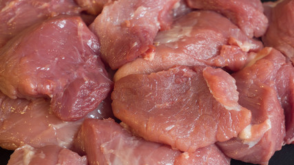 Meat dishes are prepared in the restaurant by the chef. Organic meat from the farm. Cooking for lunch the fresh diet of red meat for gourmets. Red meat on a black Board . Billets for barbecue or kebab