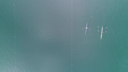 4K overhead shot of rowing boats preparing for a competition on the pond of Banyoles, a small city of Catalonia - Powered by Adobe