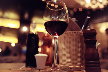 glass of red wine in restaurant interior