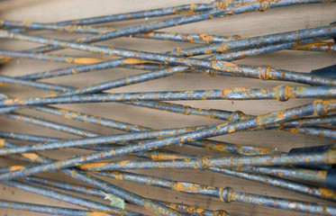 crisscross metal rods with rust