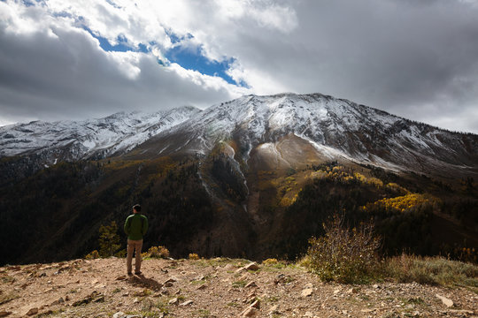 A man takes in the view of Mount Nebo (11,928 ft), the highest point in the Wasatch Mountain Range, from the Mount Nebo Overlook along the Mount Nebo Scenic Byway in central Utah.